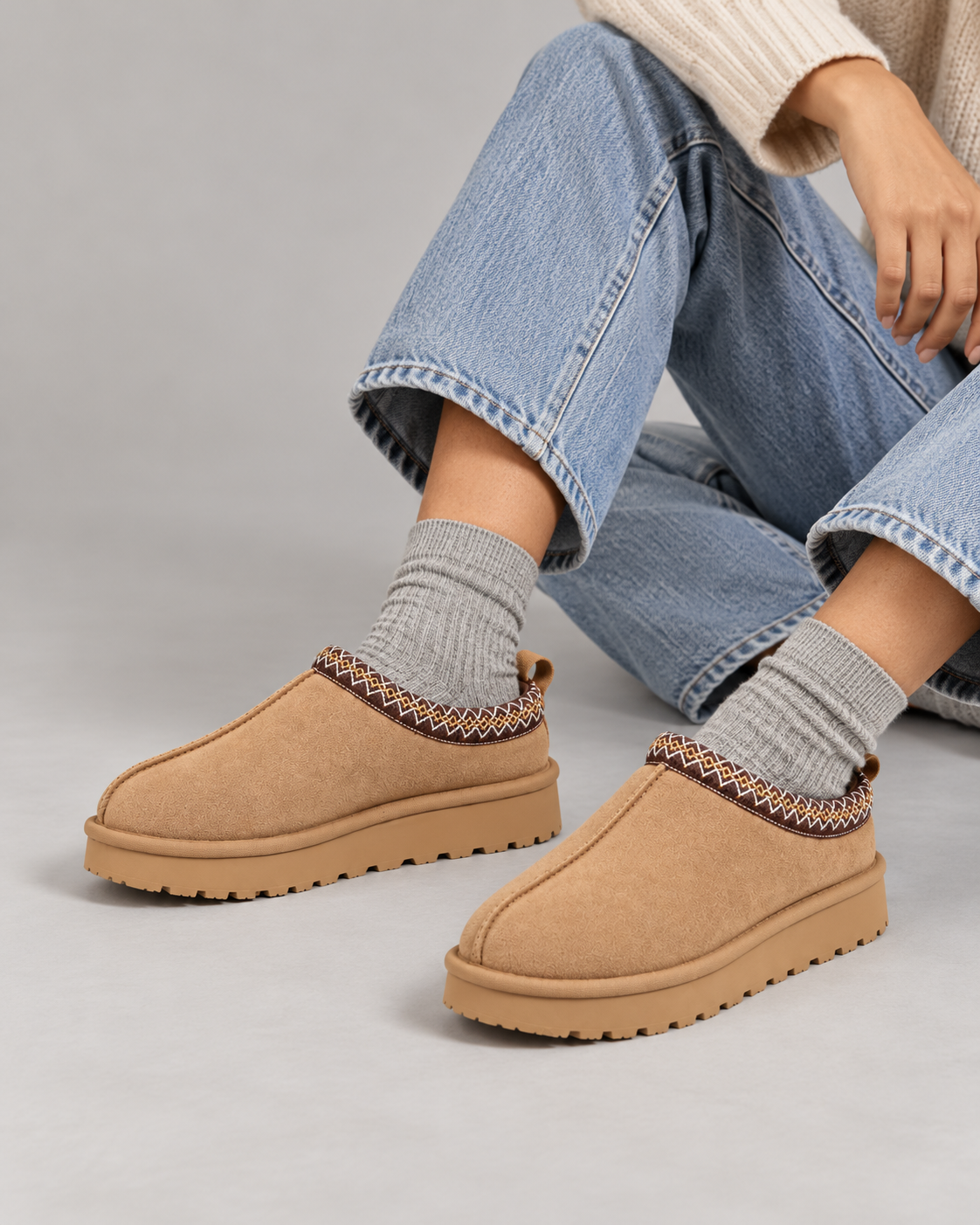 Slipperella camel Aztec slipper boots in a seated studio pose