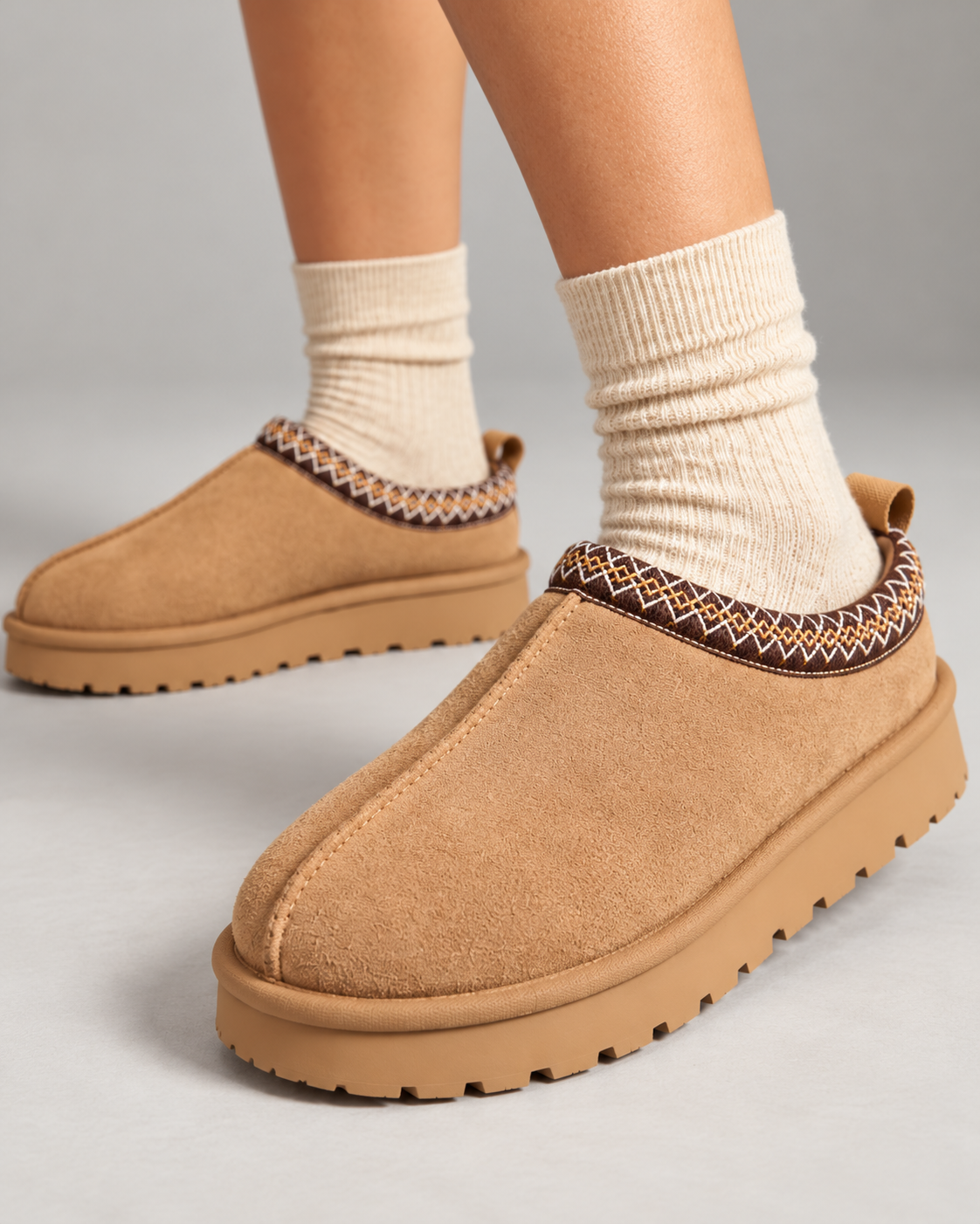 Close-up of Slipperella camel Aztec slipper boots showing suede texture and embroidered trim